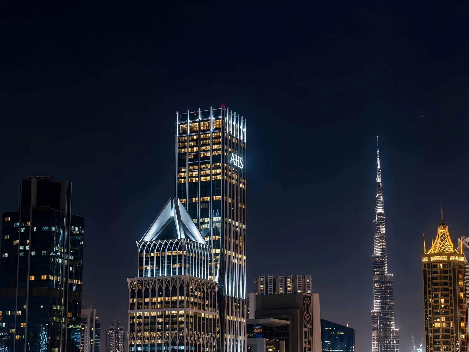 AHS Tower at night with Burj Khalifa in view, official render