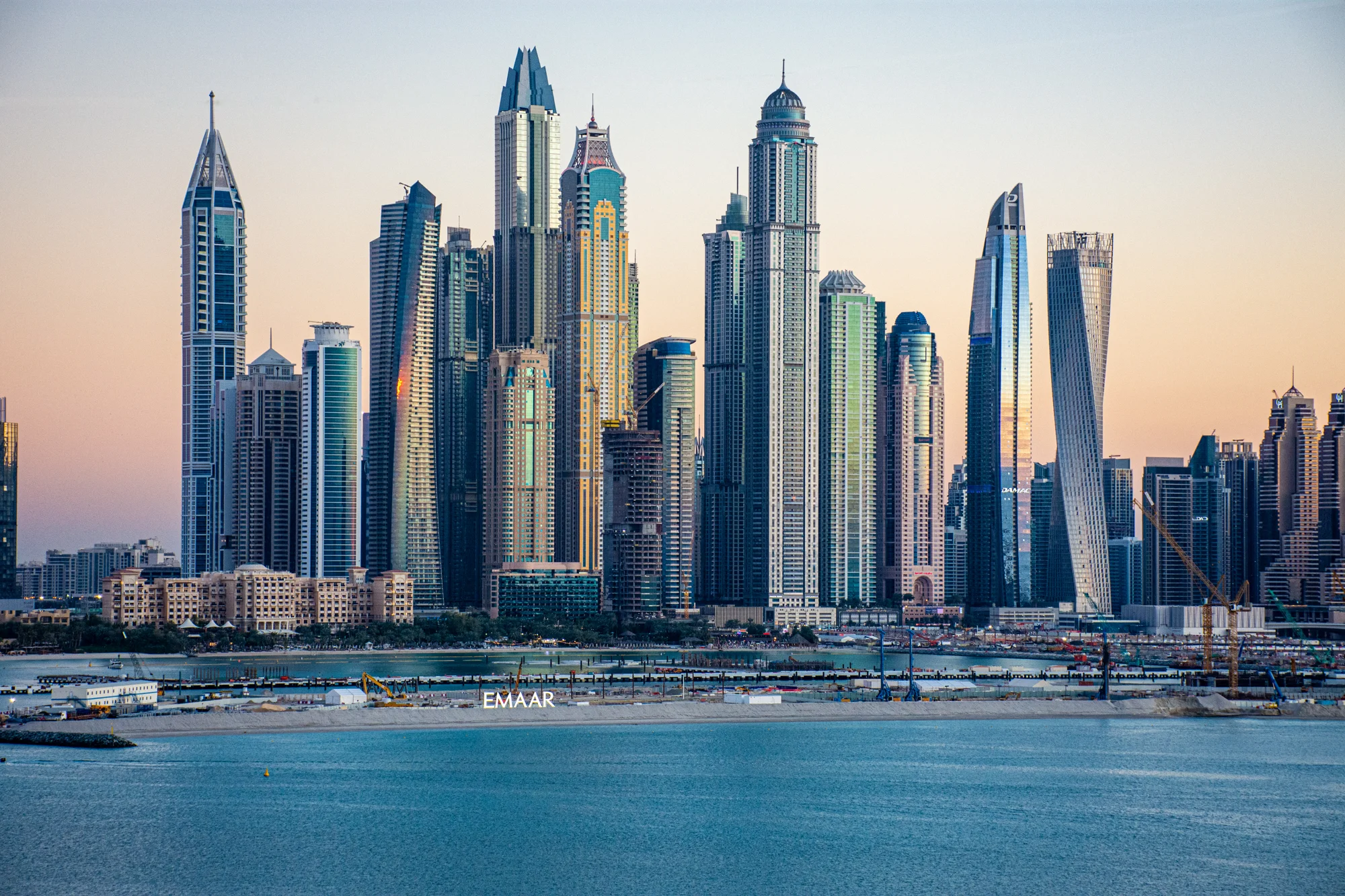 Dubai Marina skyline at sunset seen from the sea