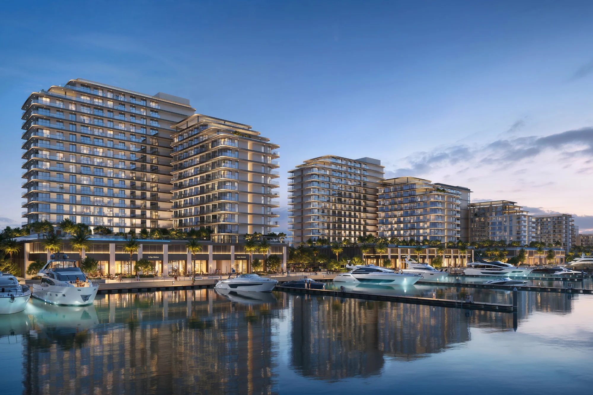 Fior 1 waterfront render at Rashid Yachts and Marina by Emaar, with yachts berthed in front of the residential buildings at dusk