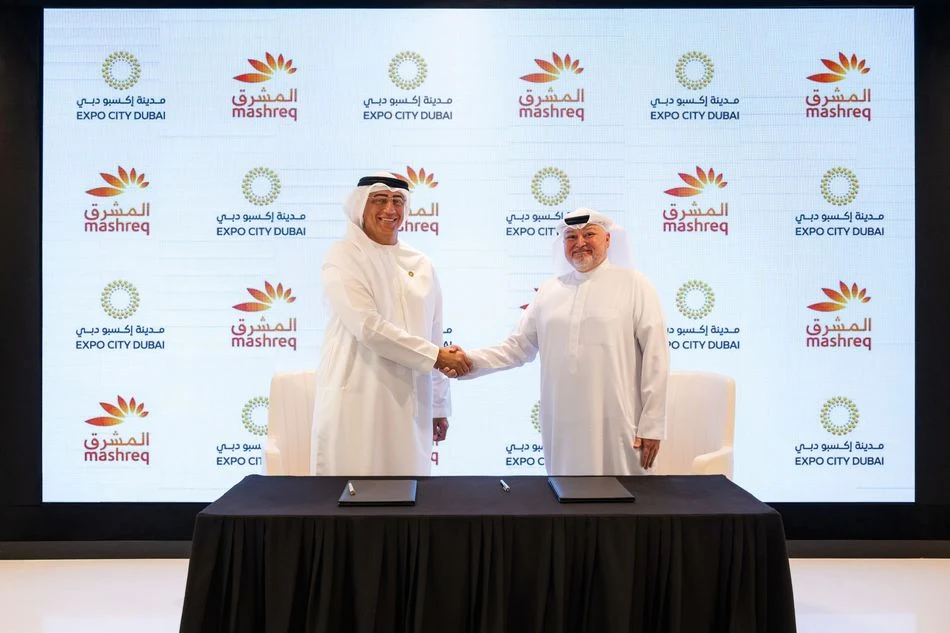 Mashreq and Expo City Dubai officials shake hands at the off-plan home financing partnership signing