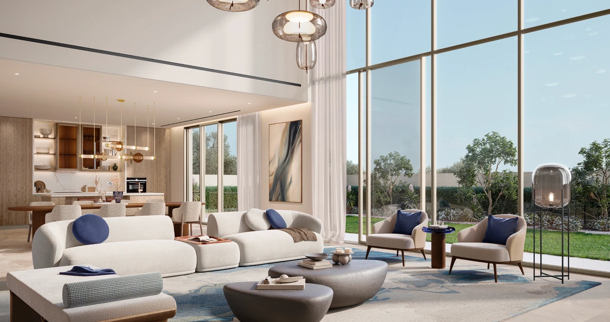 Double-height living room in a Talay villa with floor-to-ceiling glazing onto the private garden