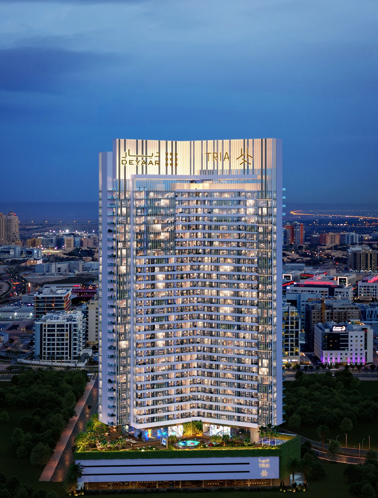 Tria tower by Deyaar lit at night above Dubai Silicon Oasis