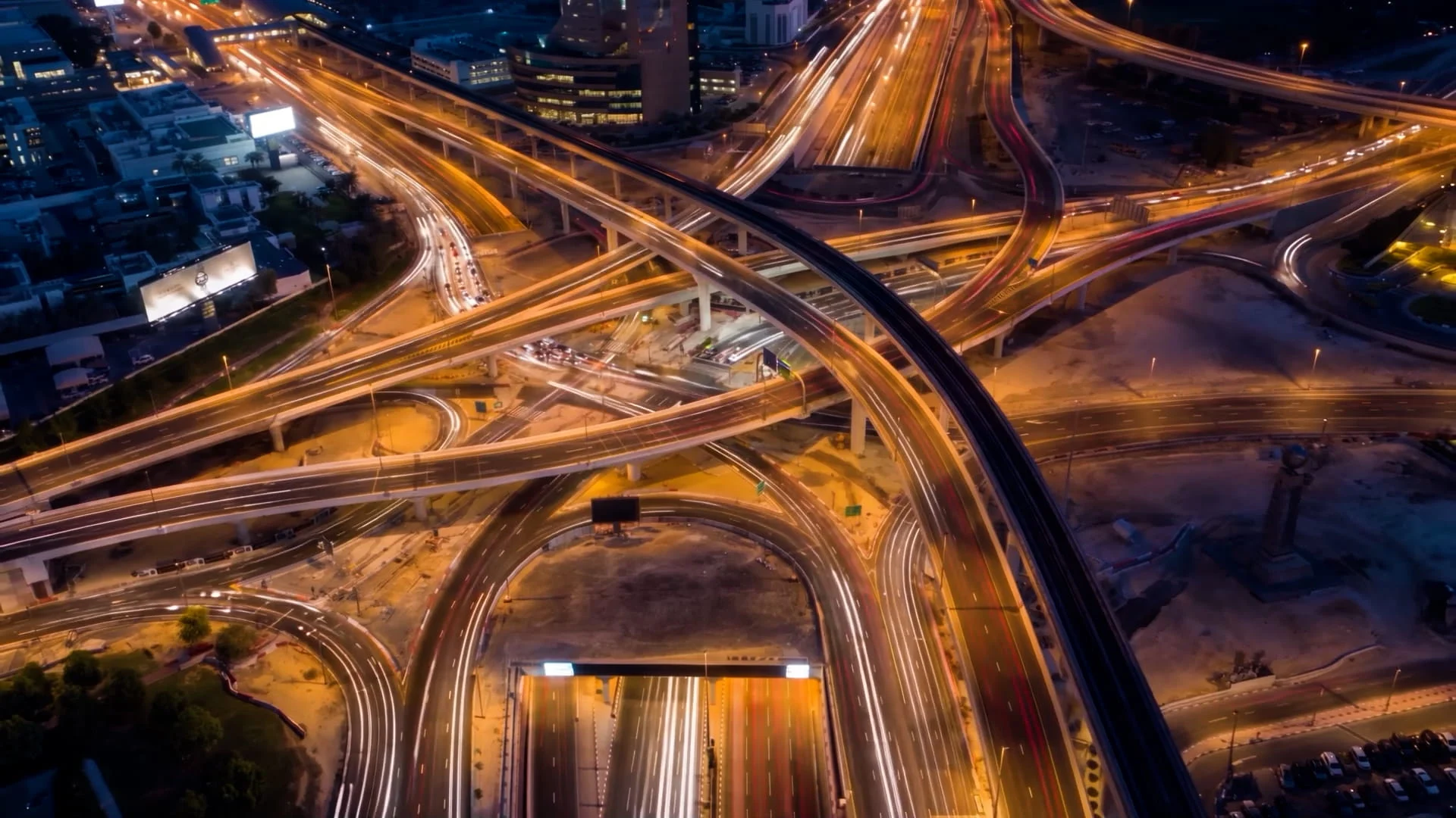 World Trade Centre Roundabout interchange at night with traffic on the new bridges, Dubai